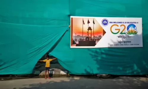Behind green sheets: Modi accused of hiding poverty during G20 summit