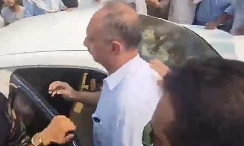 PTI workers surround Omar Ayub after iddat verdict, demand agitation