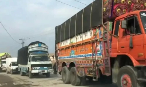A still from an old video shows truck loaded with basic items lined for Kurram, Khyber Pakhtunkhwa. Screengrab via Aaj News/File