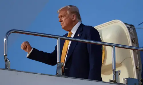 Trump targets China trade deal as he arrives in Tokyo on Asia tour