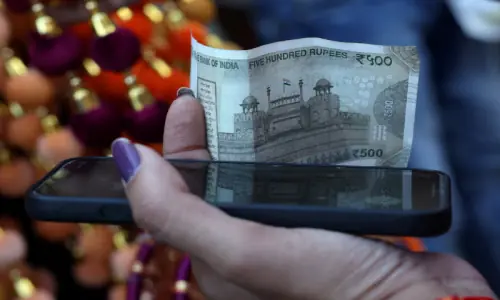 Indian rupee cracks below 90 to the dollar, hit by tariffs, capital outflows