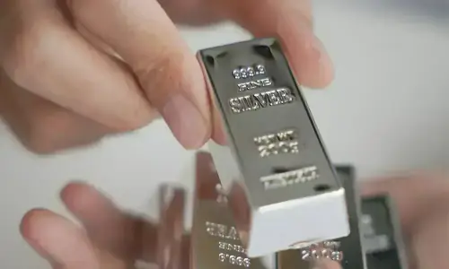 Silver tops $75 as gold and platinum surge to records