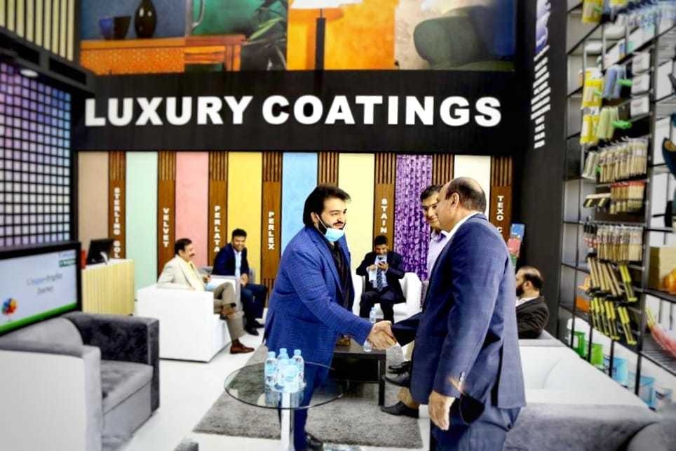 Dignitaries and Businessmen share greetings with each other at the inauguration. Dignitaries and Businessmen share greetings with each other at the inauguration.