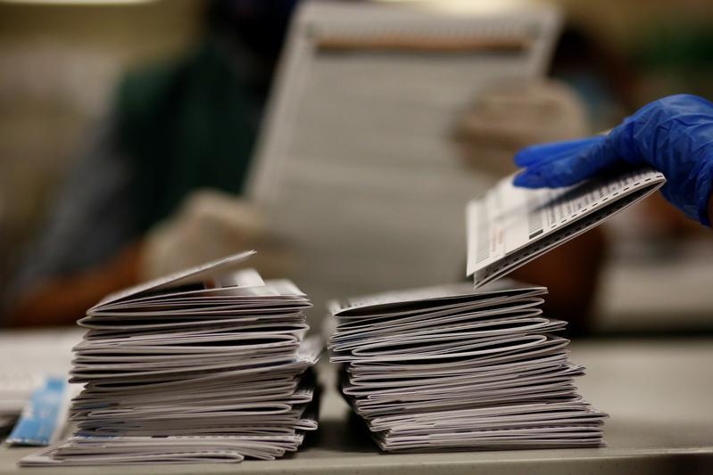 U.S. early voting tops 60 million as historic pace continues