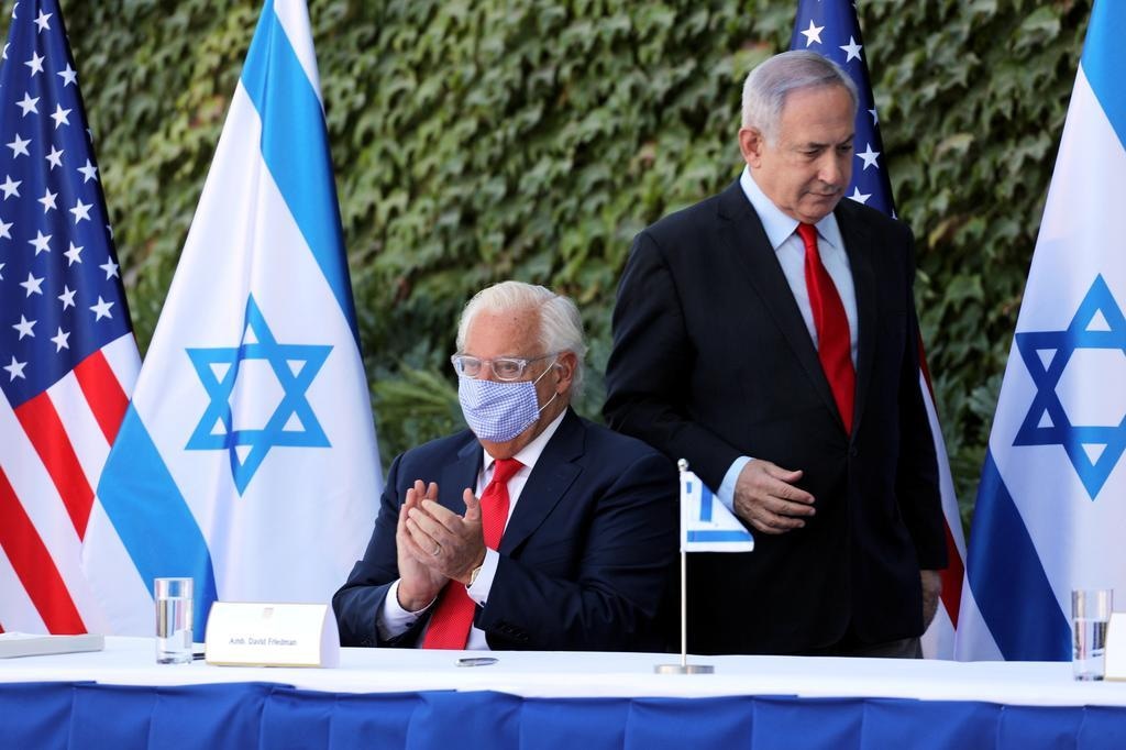 Ahead of U.S. poll, Trump ends a U.S. restriction applying to Israeli settlements