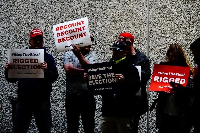 Facebook, Twitter purge violent rhetoric as tensions rise over election
