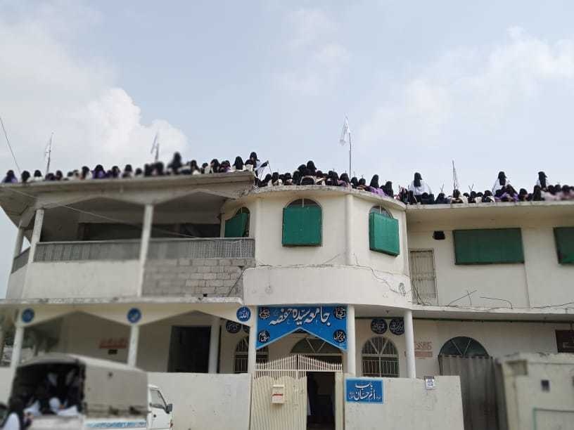 Hundreds of women clad in burka gathered on the roof top of the seminary where the flag was hoisted. Roohan Ahmed Twitter Hundreds of women clad in burka gathered on the roof top of the seminary where the flag was hoisted. Roohan Ahmed Twitter