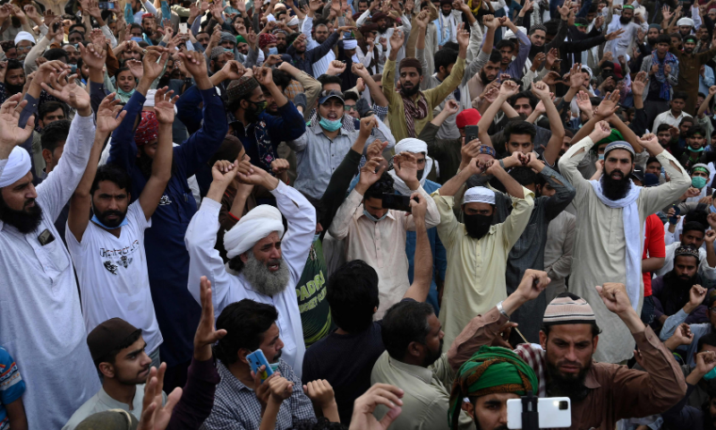 In this file photo, supporters of the banned Tehreek-e-Labbaik Pakistan party shout slogans as they block a street during a protest on April 19. AFP Photo