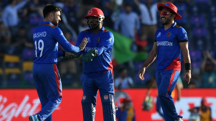 Afghanistan's Rashid Khan (L) celebrates after taking the wicket of Namibia's Zane Green (not pictured) during the ICC men’s Twenty20 World Cup cricket match between Afghanistan and Namibia. AFP Photo Afghanistan's Rashid Khan (L) celebrates after taking the wicket of Namibia's Zane Green (not pictured) during the ICC men’s Twenty20 World Cup cricket match between Afghanistan and Namibia. AFP Photo