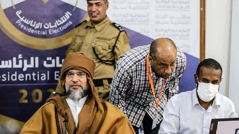 Saif al-Islam Gaddafi, son of late Libyan leader Muammar Gaddafi is pictured the other day after signing documents at the election centre in the southern town of Sebha, Libya. AFP Photo