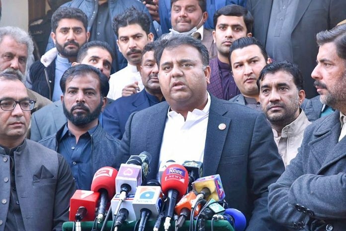 Information Minister Fawad Chaudhry addresses a press conference in Jhelum. APP