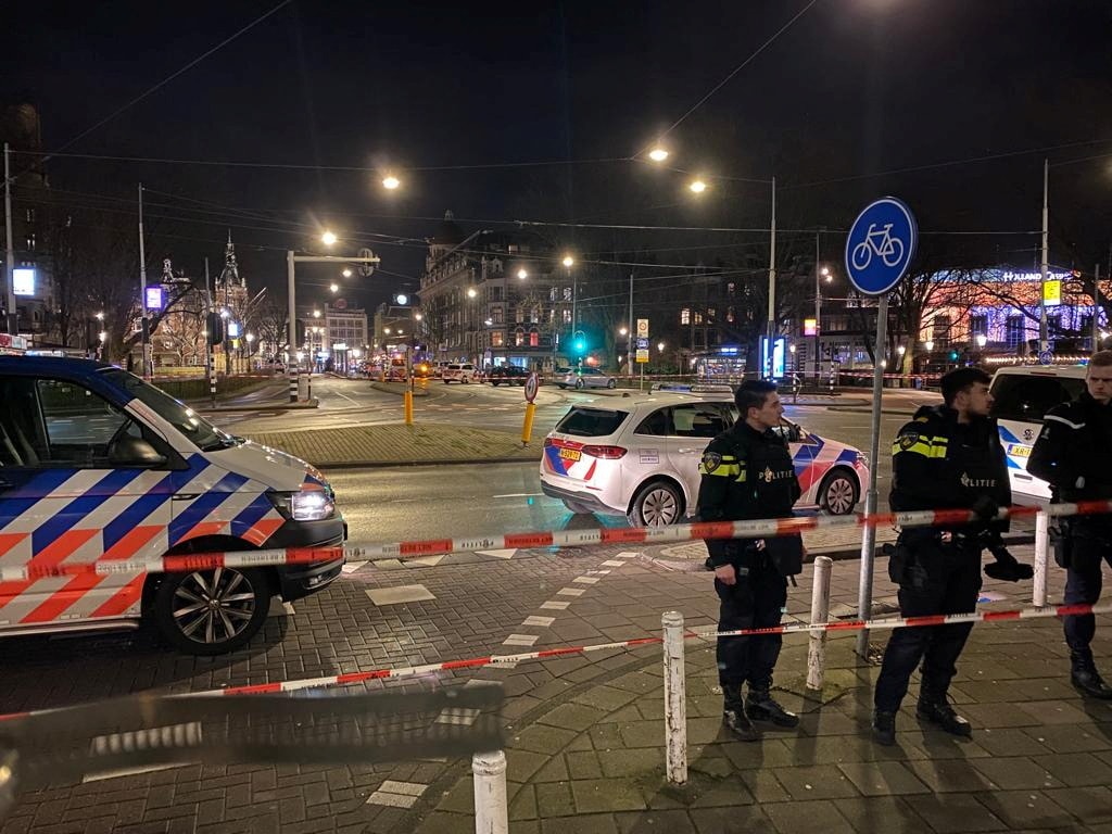Police stopped the man, identified as a 27-year-old from Amsterdam, by running into him forcefully with a car as he chased after his hostage when the hostage fled from the Apple AAPL.O flagship store on Tuesday night. Reuters