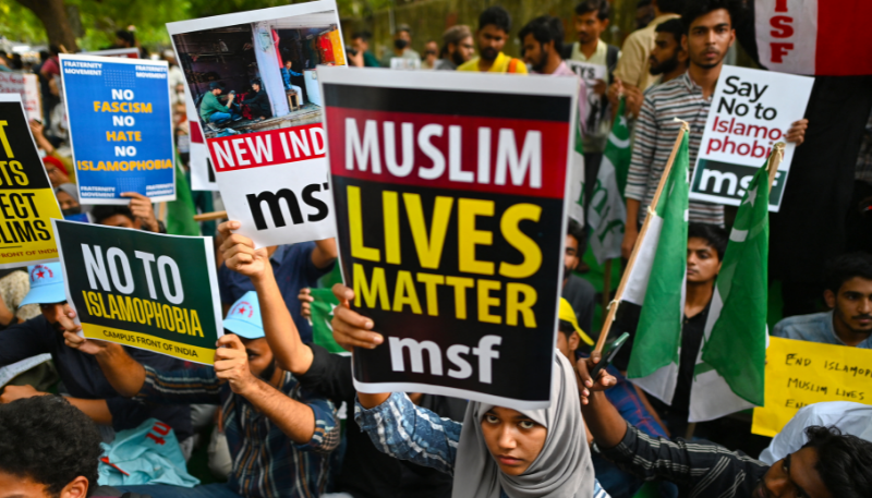 Protestors hold placards during a demonstration against anti-Muslim violence and hate crimes in New Delhi on April 16, 2022. AFP file photo
