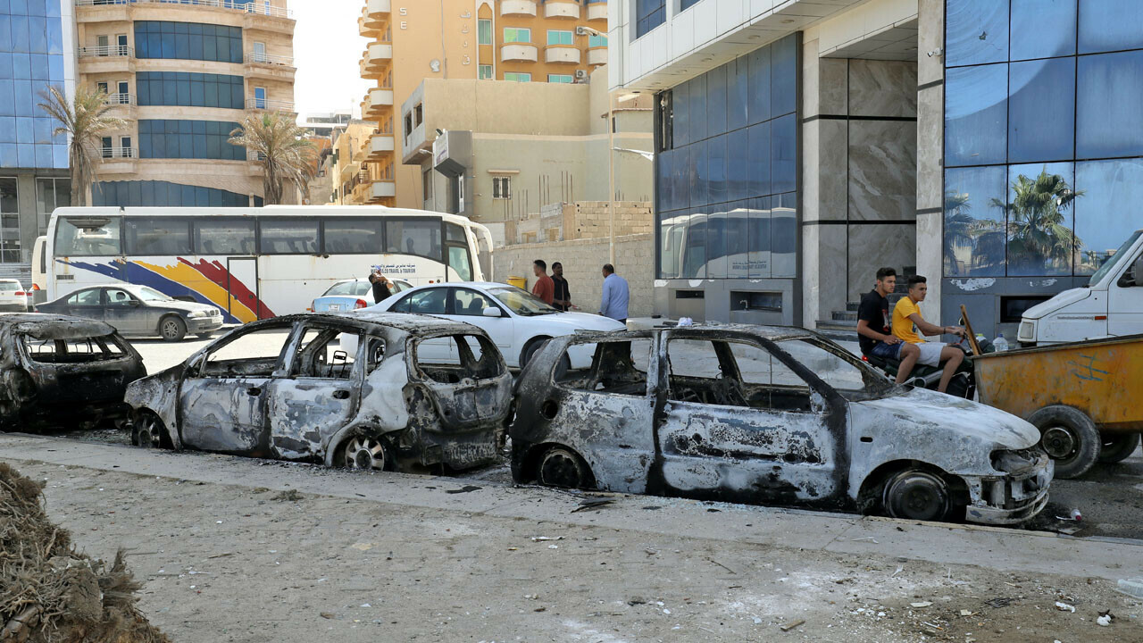 This picture taken on on May 17, 2022 in Libya&rsquo;s capital Tripoli shows a view of vehicles destroyed during fighting between forces loyal to the Tripoli-based Prime Minister Abdulhamid Dbeibah and rival forces of the Tobruk-based government. AFP photo