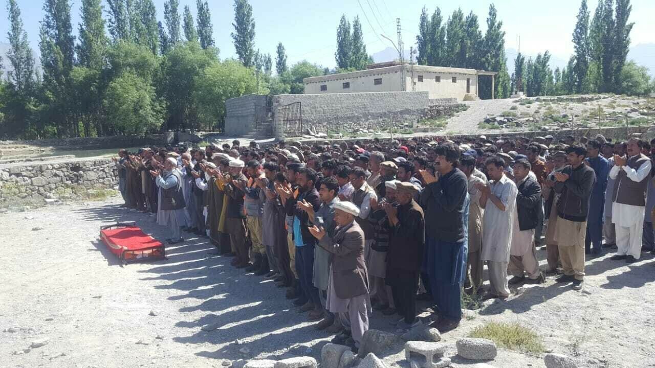 People attend the funeral of mountaineer Ali Raza Sadpara in Skardu. Photo via Qasim Hussain