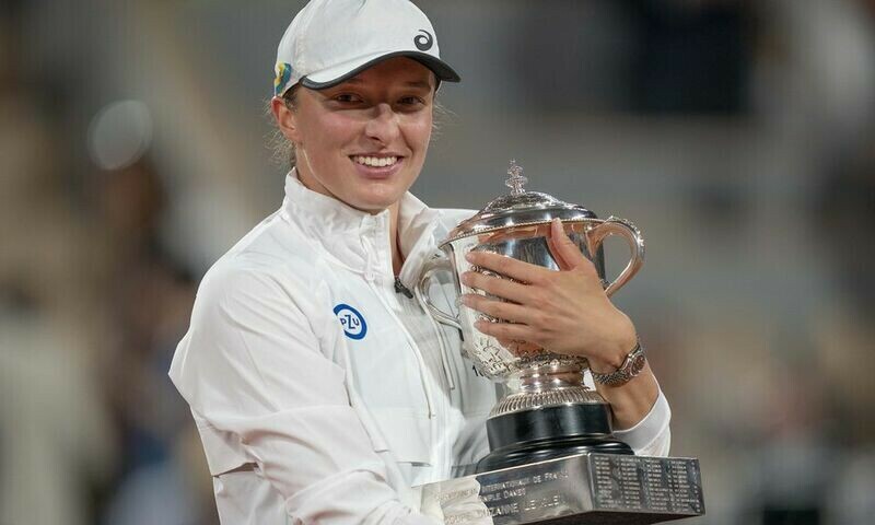 Iga Swiatek (POL) hugs the trophy after winning the women&rsquo;s singles final against Coco Gauff (USA) on day 14 of the French Open at Stade Roland-Garros. Source: Reuters