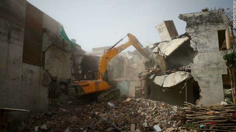 A bulldozer demolishes the house of a Muslim man in Prayagraj, India, who Uttar Pradesh state authorities accuse of being involved in riots last week. Photo by: Reuters