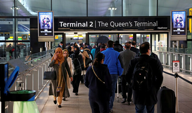 People queue to enter terminal 2, as tighter rules for international travellers start, at Heathrow Airport, amid the spread of the coronavirus disease, in London, Britain, on January 18, 2021. (REUTERS)