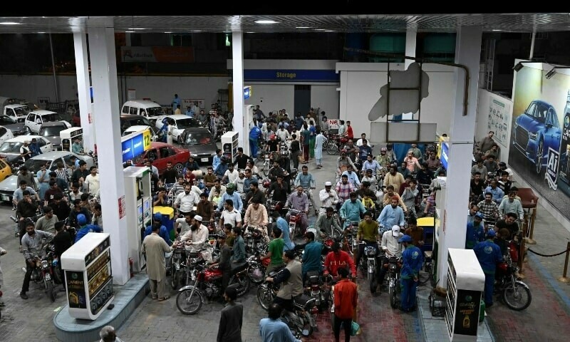 Motorists wait to fill their vehicles’ tanks at a petrol station in Islamabad following an increase of petroleum prices by the government on Thursday. AFP file photo