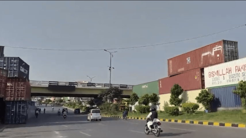Dozen of shipping containers have been placed at Faizabad intersection in Islamabad. PHOTO TWITTER Dozen of shipping containers have been placed at Faizabad intersection in Islamabad. PHOTO TWITTER