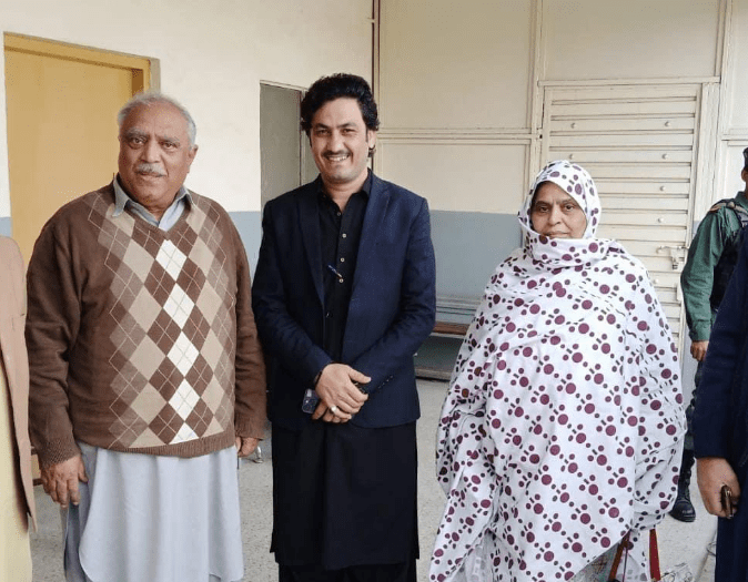 Professor Ismail (left) and his wife are seen out outside and anti-terrorism court in Peshawar.