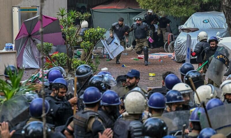 Riot police enter the residence of former prime minister Imran Khan in Lahore on March 18, 2023, after Khan left for Islamabad to appear in a court. AFP