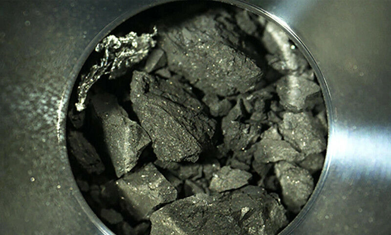 The black particles from an asteroid some 300 million kilometres away look unremarkable, but they hold a component of life itself. AFP