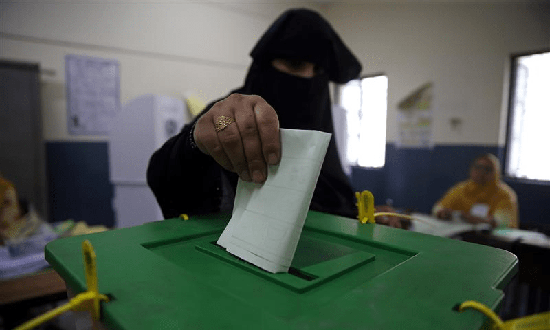 A woman casts her vote at a polling station during the general election in Islamabad on July 25, 2018. Reuters