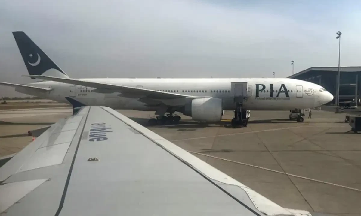Pakistan International Airlines passenger plane sits on tarmac, as seen through a plane window, at the Islamabad International Airport, Islamabad on October 27, 2024. Reuters Pakistan International Airlines passenger plane sits on tarmac, as seen through a plane window, at the Islamabad International Airport, Islamabad on October 27, 2024. Reuters