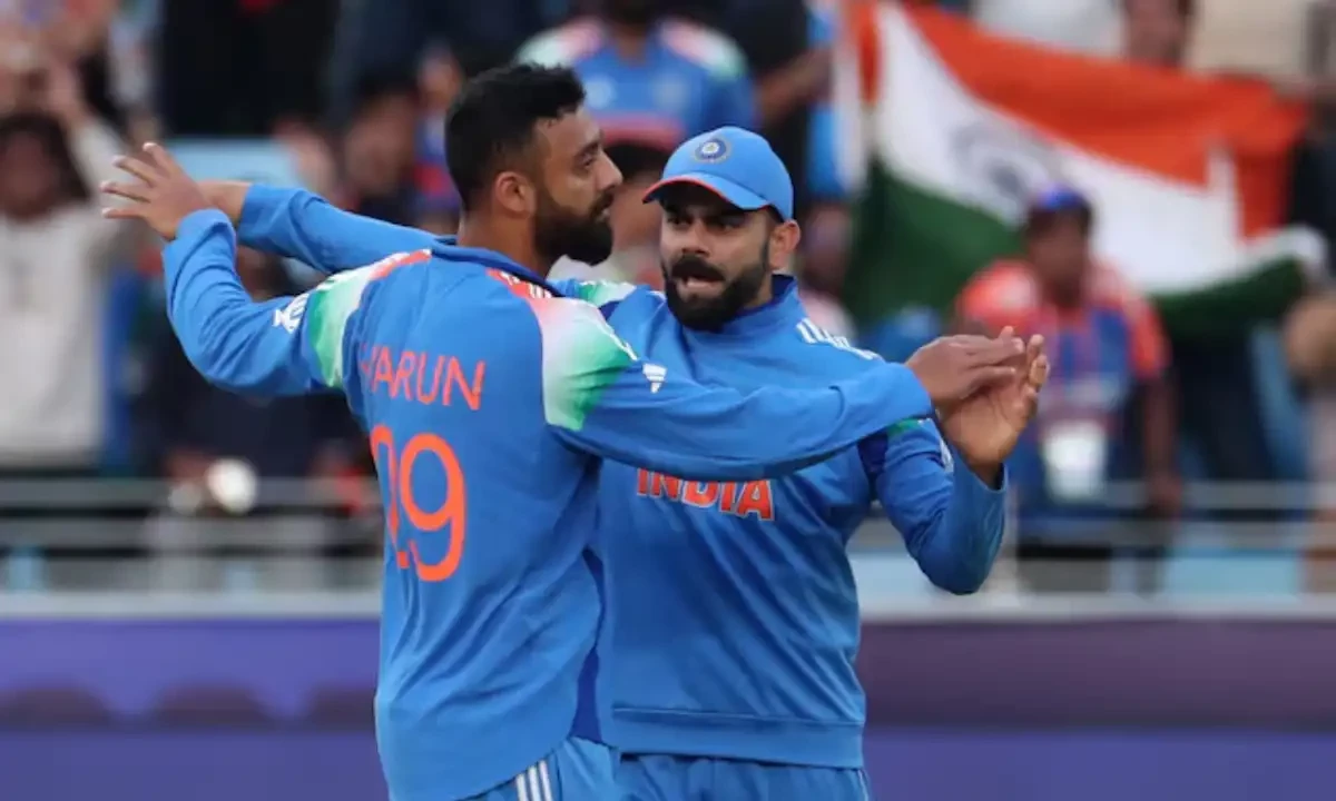 India’s Varun Chakravarthy celebrates with Virat Kohli after taking the wicket of New Zealand’s Will Young on March 2,2025. Reuters India’s Varun Chakravarthy celebrates with Virat Kohli after taking the wicket of New Zealand’s Will Young on March 2,2025. Reuters