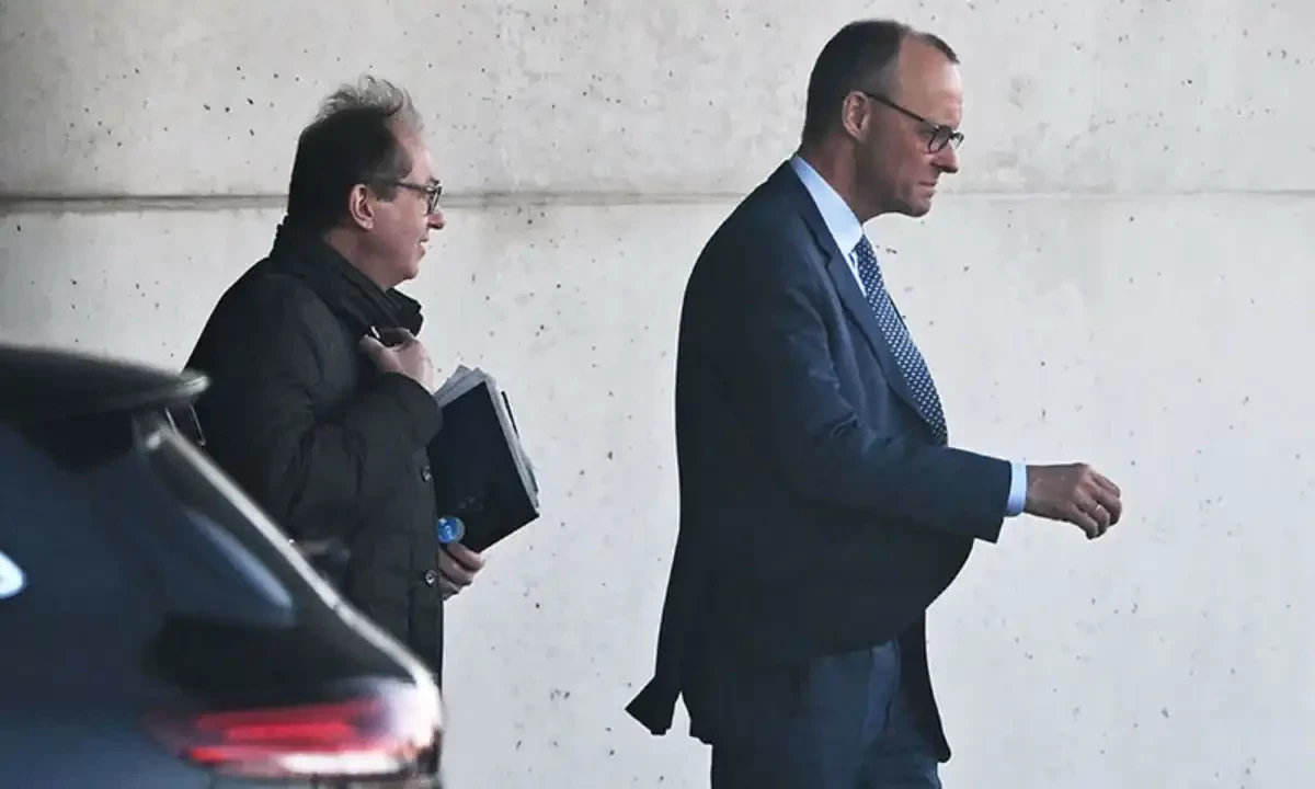 Friedrich Merz (R), leader of Germany’s conservative Christian Democratic Union party, leaves after a meeting at the Chancellery in Berlin, Germany, on March 5. — AFP Friedrich Merz (R), leader of Germany’s conservative Christian Democratic Union party, leaves after a meeting at the Chancellery in Berlin, Germany, on March 5. — AFP