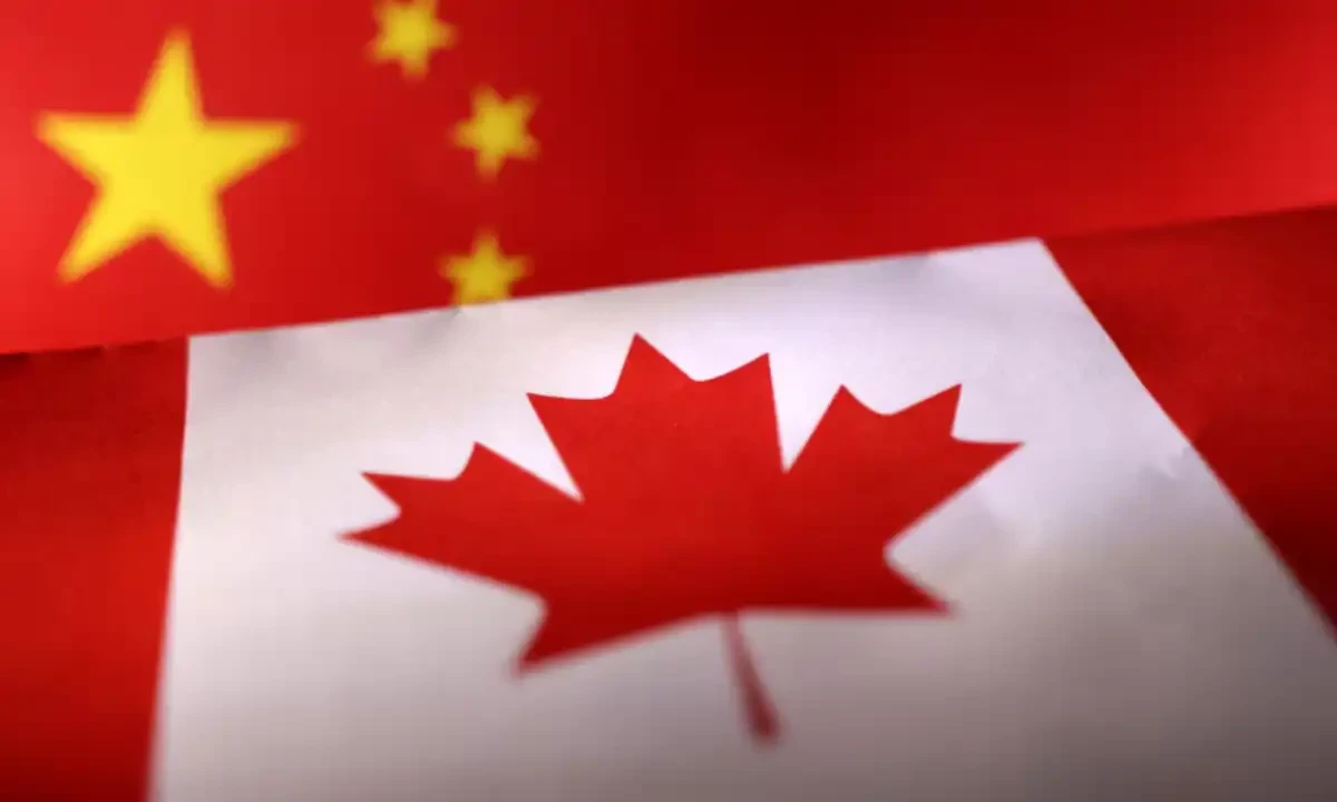 Printed Chinese and Canada flags are seen in this illustration, July 21, 2022. Reuters Printed Chinese and Canada flags are seen in this illustration, July 21, 2022. Reuters
