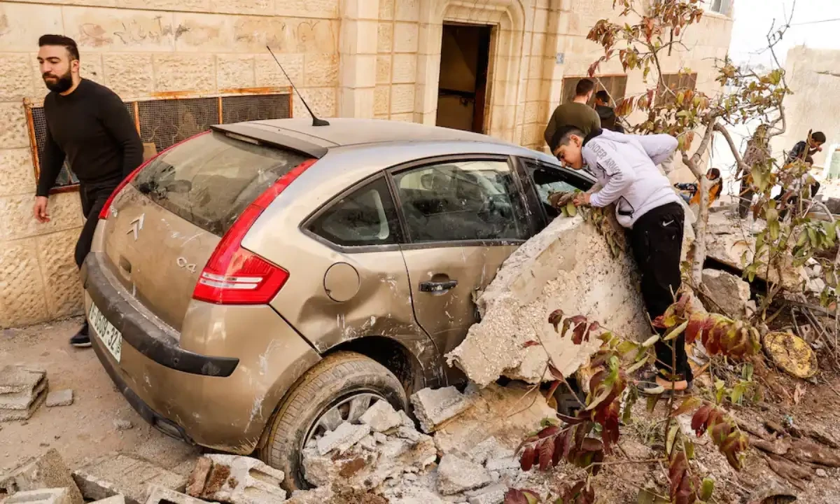 Palestinians stand near a damaged vehicle, near the site where several Palestinians were killed in an Israeli raid in Jenin, in the Israeli-occupied West Bank, on March 11, 2025. Reuters Palestinians stand near a damaged vehicle, near the site where several Palestinians were killed in an Israeli raid in Jenin, in the Israeli-occupied West Bank, on March 11, 2025. Reuters