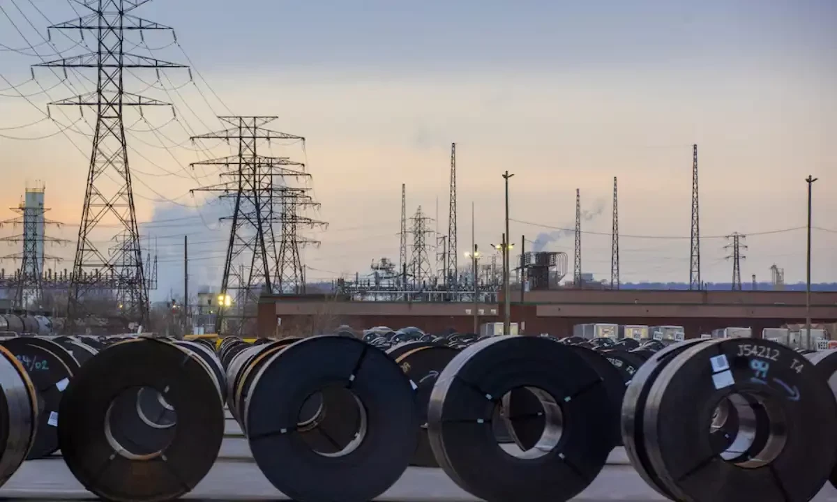 Coils of rolled steel sit in an industrial yard with transmission towers and smokestacks in the background at dusk in Hamilton, Ontario, on January 27, 2025. Reuters file Coils of rolled steel sit in an industrial yard with transmission towers and smokestacks in the background at dusk in Hamilton, Ontario, on January 27, 2025. Reuters file