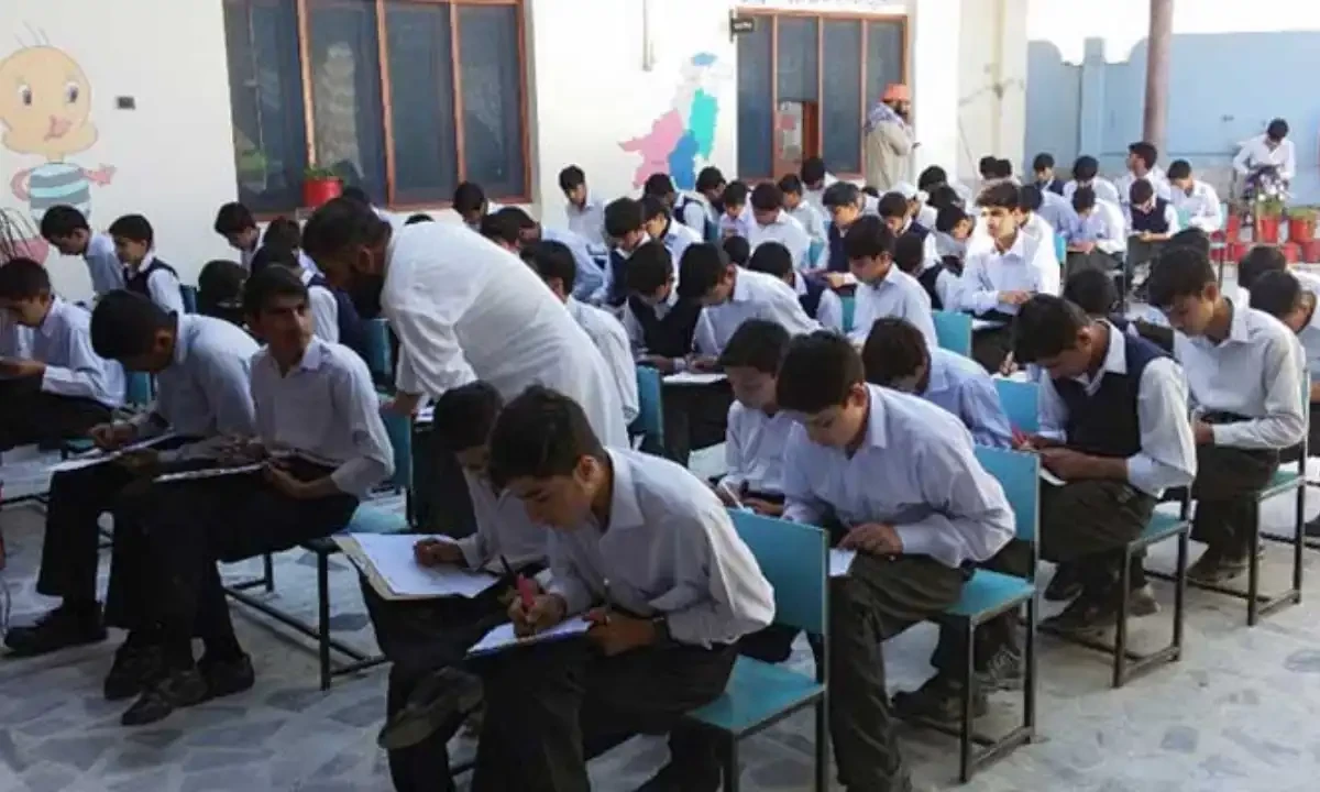 Students sit for an exam in Swat. AFP