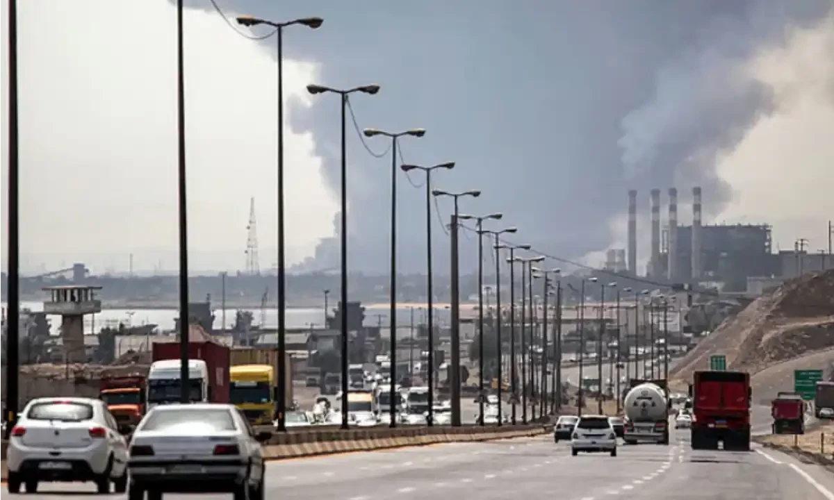 A thick plume of smoke billows as motorists drive their vehicles along a highway near the source of an explosion at the Shahid Rajaee port dock southwest of Bandar Abbas in the Iranian province of Hormozgan. AFP A thick plume of smoke billows as motorists drive their vehicles along a highway near the source of an explosion at the Shahid Rajaee port dock southwest of Bandar Abbas in the Iranian province of Hormozgan. AFP
