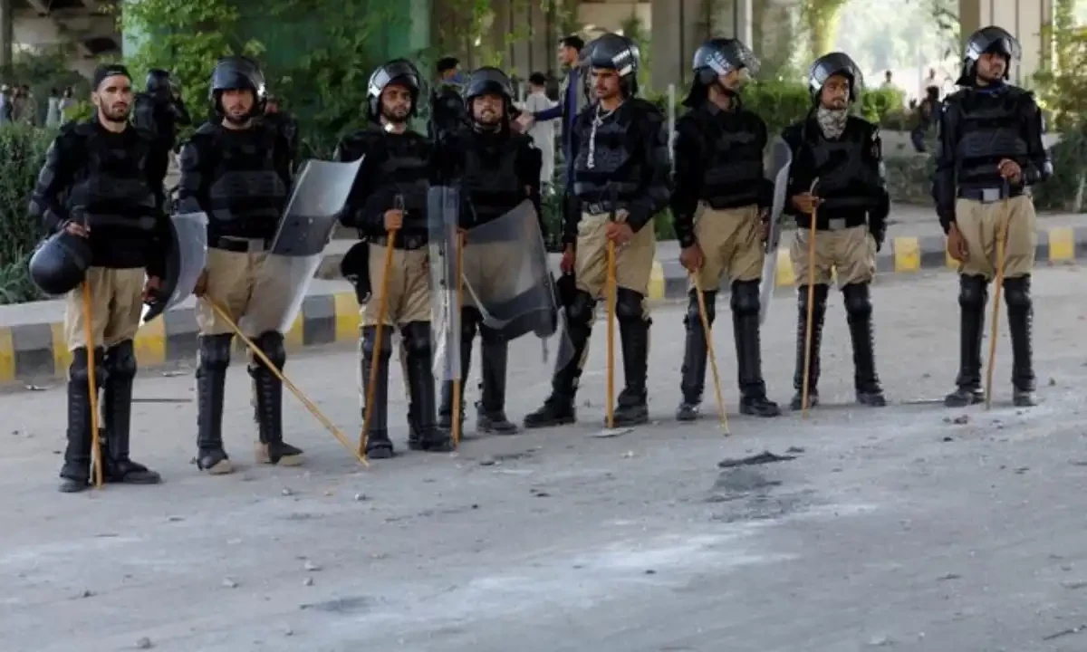 Police officer in riot gear stand guard outside a Radio Pakistan office building after it was set afire by the supporters of Pakistan’s former Prime Minister Imran Khan during a protest against his arrest, in Peshawar, Pakistan, May 11, 2023. Reuters Police officer in riot gear stand guard outside a Radio Pakistan office building after it was set afire by the supporters of Pakistan’s former Prime Minister Imran Khan during a protest against his arrest, in Peshawar, Pakistan, May 11, 2023. Reuters