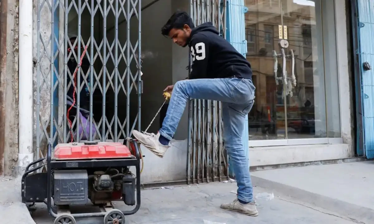 A man starts a generator outside his shop during a country-wide power breakdown in Karachi, Pakistan January 23, 2023. Reuters A man starts a generator outside his shop during a country-wide power breakdown in Karachi, Pakistan January 23, 2023. Reuters