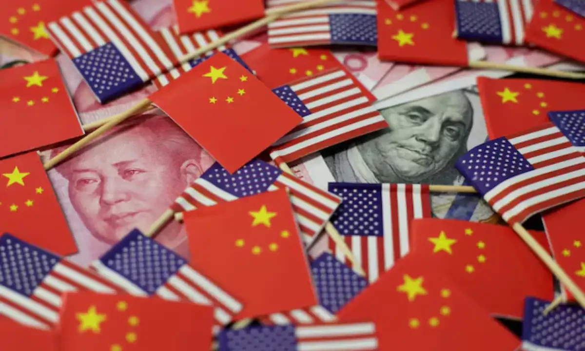 A U.S. dollar banknote featuring American founding father Benjamin Franklin and a China’s yuan banknote featuring late Chinese chairman Mao Zedong are seen among U.S. and Chinese flags in this illustration picture taken May 20, 2019. Reuters A U.S. dollar banknote featuring American founding father Benjamin Franklin and a China’s yuan banknote featuring late Chinese chairman Mao Zedong are seen among U.S. and Chinese flags in this illustration picture taken May 20, 2019. Reuters