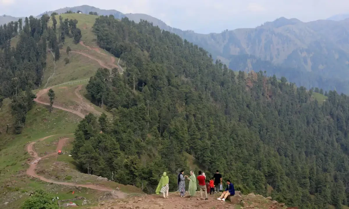 Tourists stand at a view point at Pir Chinasi, a tourist attraction in Pakistan-administered Kashmir, May 4, 2025. Reuters Tourists stand at a view point at Pir Chinasi, a tourist attraction in Pakistan-administered Kashmir, May 4, 2025. Reuters