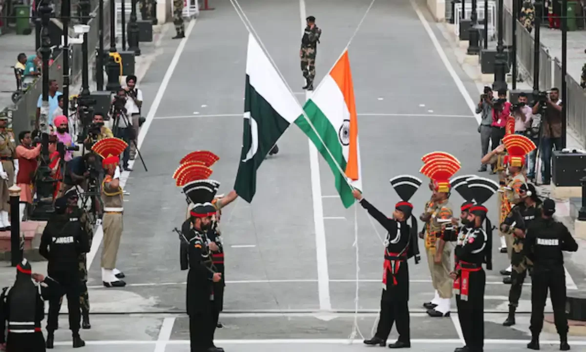 Pakistani Rangers (wearing black uniforms) and Indian Border Security Force (BSF) officers lower their national flags during parade on the Pakistan’s 72nd Independence Day, at the Pakistan-India joint check-post at Wagah border, near Lahore, Pakistan August 14, 2019. Reuters Pakistani Rangers (wearing black uniforms) and Indian Border Security Force (BSF) officers lower their national flags during parade on the Pakistan’s 72nd Independence Day, at the Pakistan-India joint check-post at Wagah border, near Lahore, Pakistan August 14, 2019. Reuters