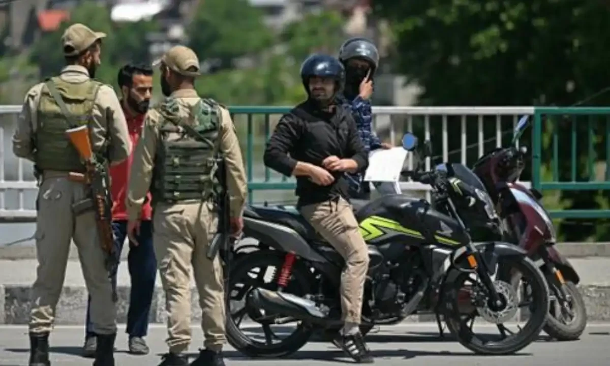 Indian policemen inspect commuters along a road in Srinagar on May 12, 2025. AFP Indian policemen inspect commuters along a road in Srinagar on May 12, 2025. AFP