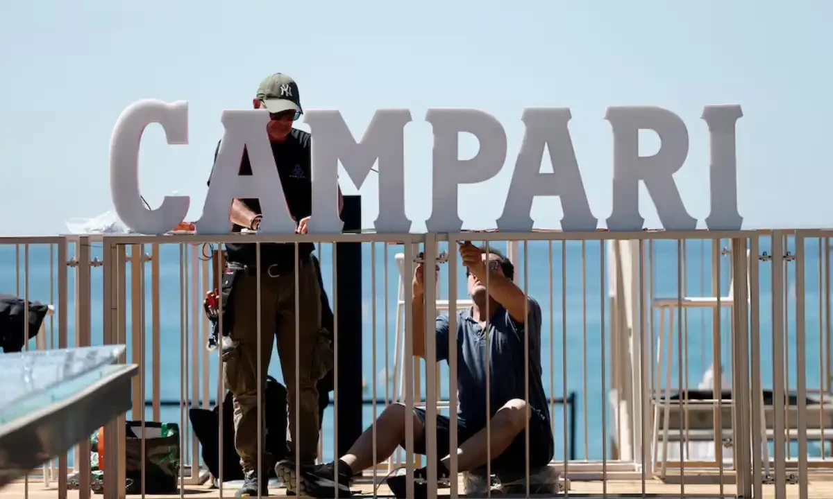 Wrokers install a Campari sign on a private beach as preparations continue on the French Riviera before the start of the 78th Cannes Film Festival in Cannes, France, May 12, 2025. Reuters Wrokers install a Campari sign on a private beach as preparations continue on the French Riviera before the start of the 78th Cannes Film Festival in Cannes, France, May 12, 2025. Reuters