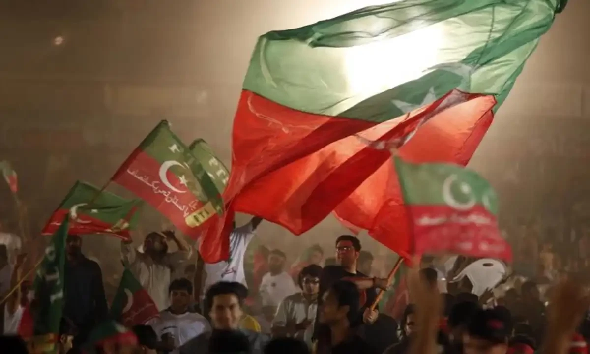 Supporters of Imran Khan, Pakistani cricketer-turned-politician and chairman of political party Pakistan Tehreek-e-Insaf wave their party’s flag during an election campaign rally in Lahore, May 5, 2013. Reuters