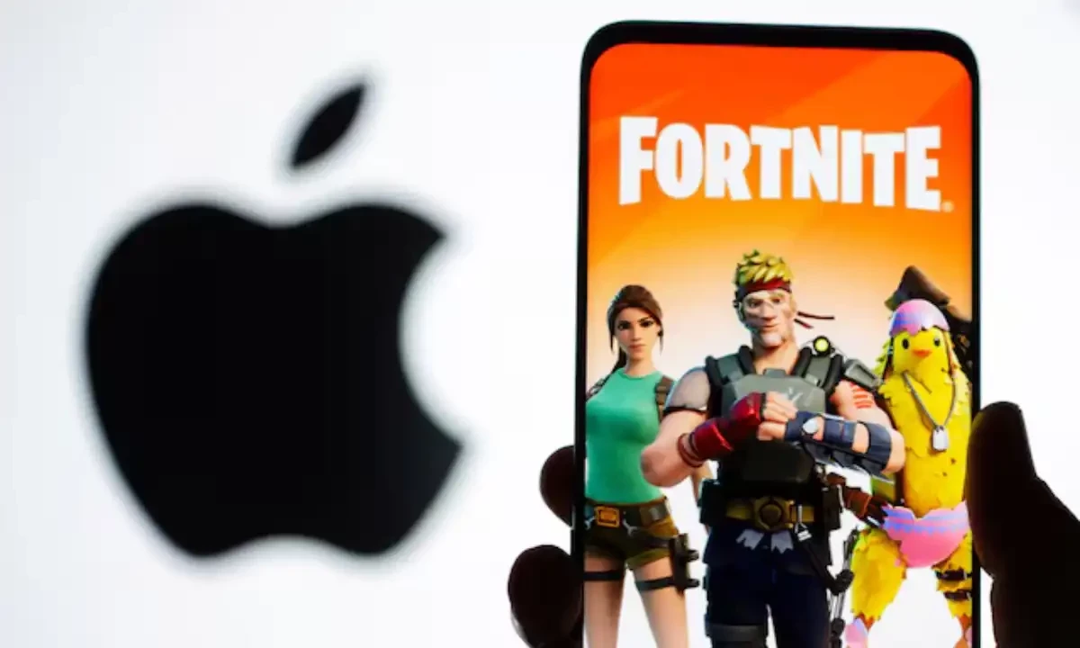 Fortnite game graphic is displayed on a smartphone in front of Apple logo in this illustration created on May 2, 2021. Reuters Fortnite game graphic is displayed on a smartphone in front of Apple logo in this illustration created on May 2, 2021. Reuters