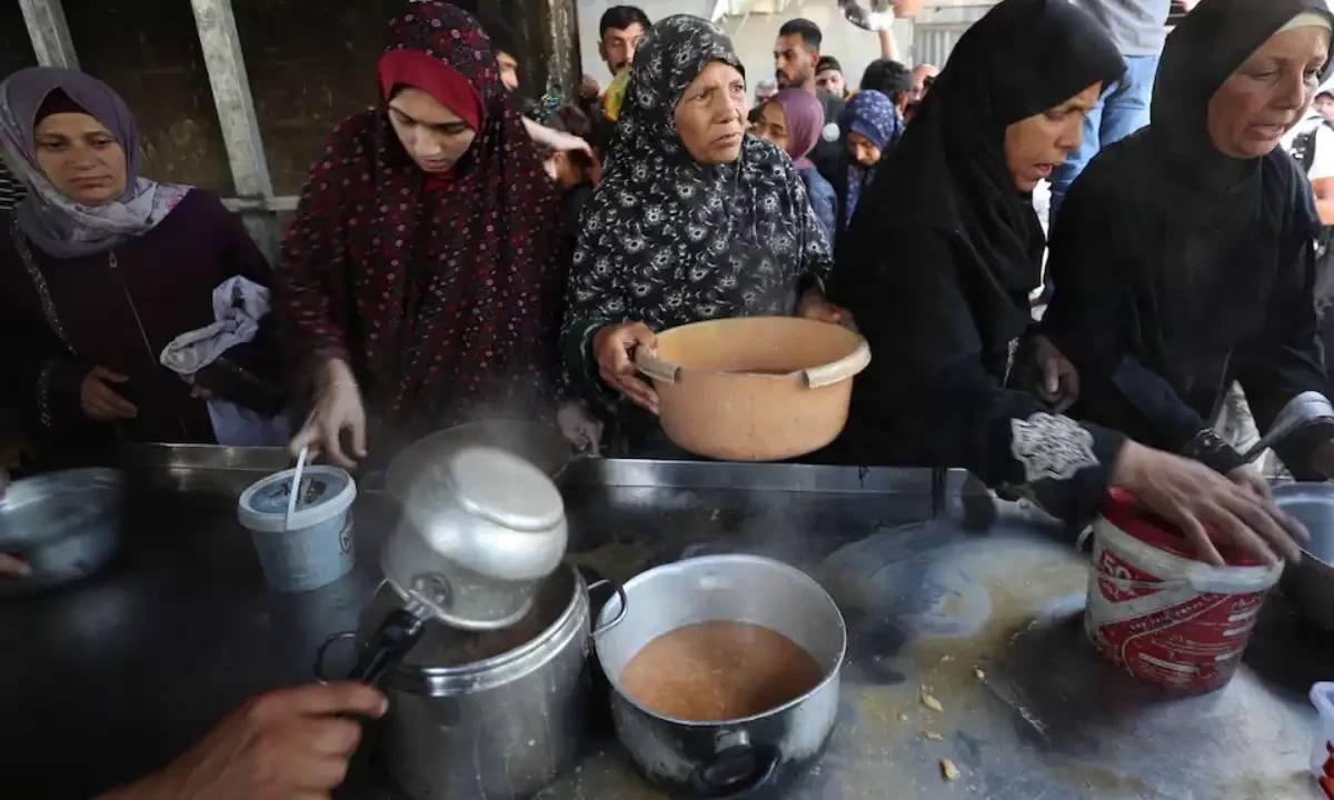 Palestinians wait to receive food cooked by a charity kitchen, in Gaza City, May 21, 2025. Reuters Palestinians wait to receive food cooked by a charity kitchen, in Gaza City, May 21, 2025. Reuters