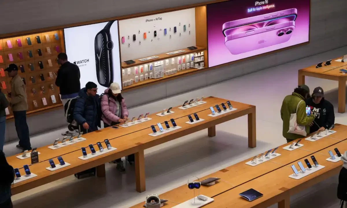 People browse iPhones at the Apple Fifth Avenue store in New York City, U.S., May 23, 2025. REUTERS People browse iPhones at the Apple Fifth Avenue store in New York City, U.S., May 23, 2025. REUTERS