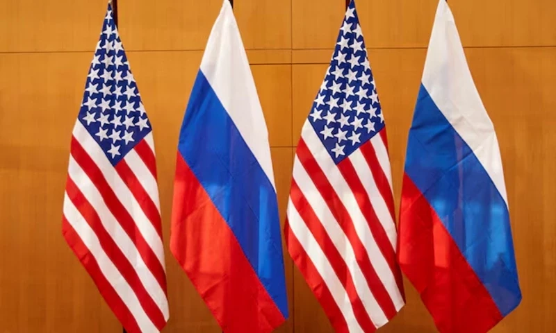 Russian and U.S. flags are pictured at the United States Mission in Geneva, Switzerland January 10, 2022. REUTERS