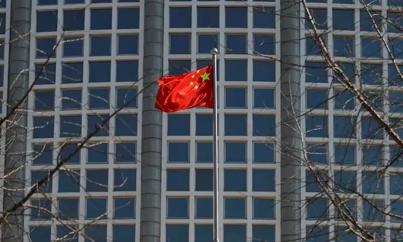 A Chinese flag flutters outside the Chinese foreign ministry in Beijing, China February 24, 2022. REUTERS A Chinese flag flutters outside the Chinese foreign ministry in Beijing, China February 24, 2022. REUTERS
