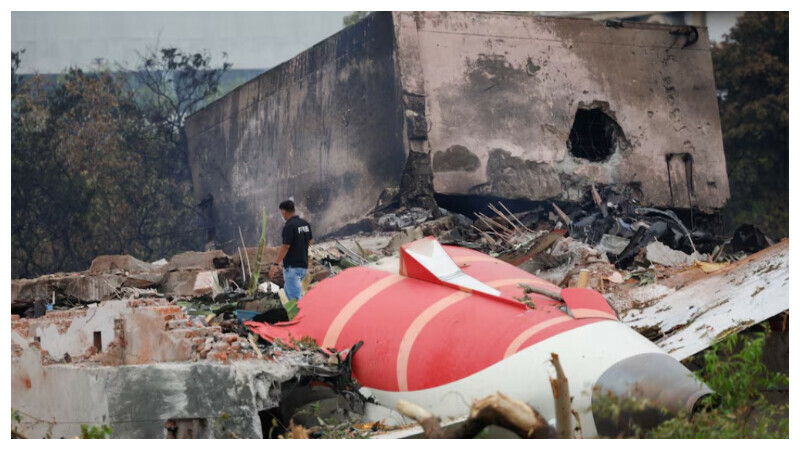 A fire offical stands next to the crashed Air India Boeing 787-8 Dreamliner aircraft, in Ahmedabad, India, June 13, 2025. REUTERS